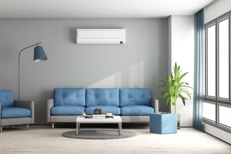 Blue and gray modern living room with sofa, armchair and air conditioner.
